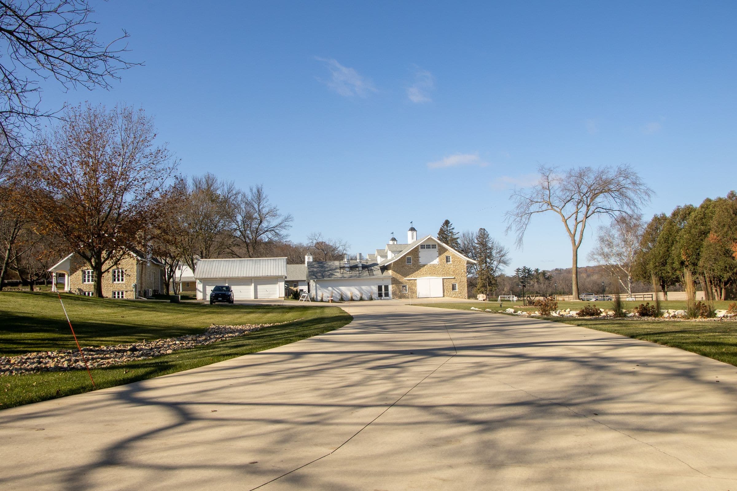 A long concrete drive to farmhouses under big trees near Canton, where we do mobile windshield replacement